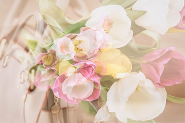 Blurred floral background, double exposure, colorful tulips. Concept of spring, holidays and gifts