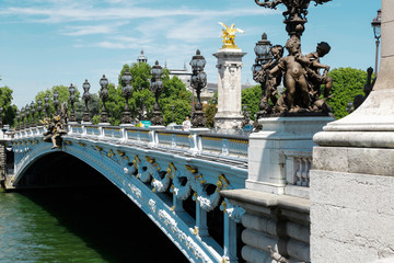 Alexander III golden bridge, symbol of Paris, in a beautiful summer day with blue sky