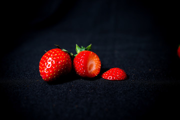 large strawberries on a black background