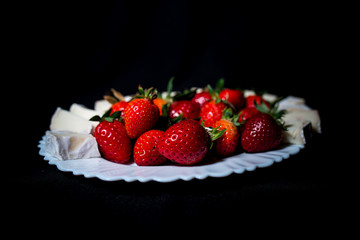large strawberries on a black background