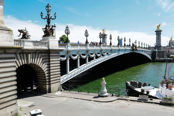 Alexander third bridge, symbol of Paris, in a beautiful summer day with blue sky, France