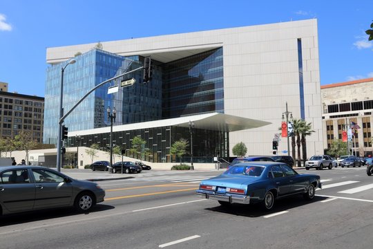 LOS ANGELES, USA - APRIL 5, 2014: Cars drive by Los Angeles Police Department building. LAPD was formed in 1869 and employs more than 12 thousand people (2013).