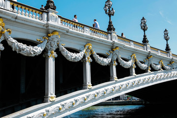 Alexander third bridge, symbol of Paris, in a beautiful summer day with blue sky, France