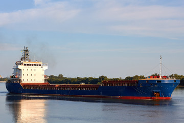 Blue cargo ship in the river