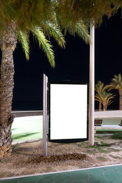 Blank Billboard Outdoors, Outdoor Advertising, Public Information Place Holder Board Advertising Stand At The Seaside Promenade At Night