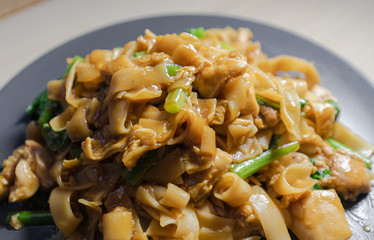 Close-up view of pad see ew, stir fried rice noodle.