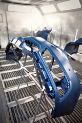 Preparation and painting of car parts after an accident.