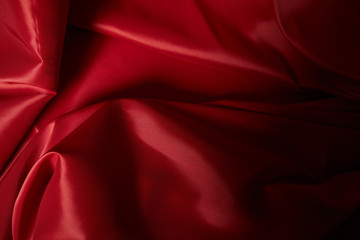 Plakat close up view of red soft and crumpled silk textured cloth