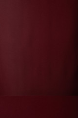 burgundy soft textured cloth background with copy space