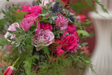 Beautiful bright wedding bouquet close-up. wedding purple boho bouquet in bride's hands