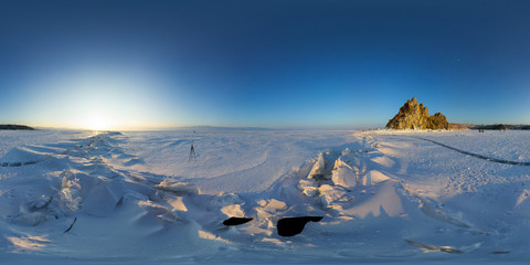 Big cracks in the ice of Lake Baikal at the Shaman Rock on Olkhon Island. Spherical 360 degree vr...
