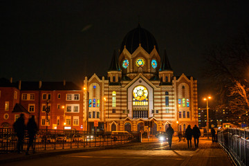 Fototapeta na wymiar Facade of the New Liberal Synagogue building in Kaliningrad at night, Kaliningrad region, Russia