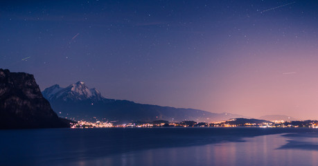 Blue night over Lake Lucerne and Pilatus Peak. Starry sky. - 329565239