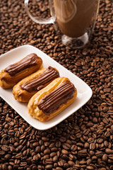 a cakes with chocolate icing on coffee beans