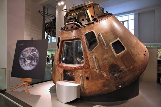 LONDON, UK - MAY 14, 2012: Visitors admire Apollo 10 space capsule at Science Museum in London. With almost 2.8 million annual visitors it is the 5th most visited museum in the UK.