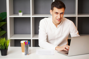 Successful businessman working in the office at the computer