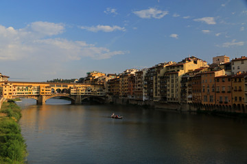 Ponte Vecchio, Old Bridge, medieval stone closed-spandrel segmental arch bridge over the Arno...