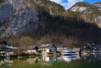 Beautiful view of houses and lake at small historical village Hallstatt. UNESCO world heritage site, old European architecture. It`s famous tourist attraction in Salzkammergut region, Austria