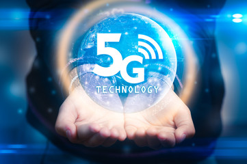 The abstract image of businessman using a smartphone overlay with 5g and cityscape hologram. the concept of 5G, communication, network, connection, internet of things.