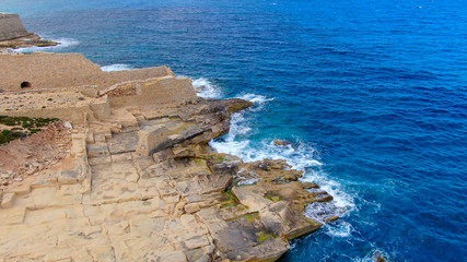 Wild Ocean water from above - Waves hitting the rocks - aerial photography