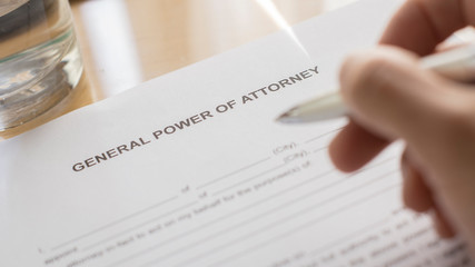 Fototapeta premium Hand writing a power of attorney with pen. General power of attorney. write a letter of attorney.