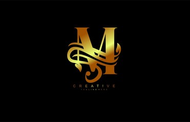 capital letter M monogram golden flourishes logotype