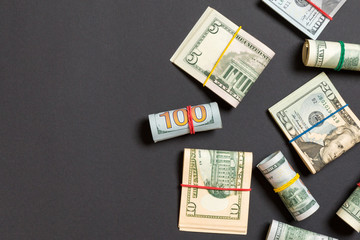 Pile of one hundred US Dollar Bills money on colored background top wiev with copy space for your text in financial concept