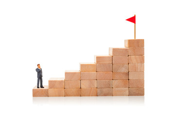 Career ladder. Steps up as symbol of the path to the goal. Man in suit stands at the beginning of...