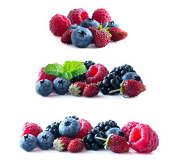 Berries isolated on white background. Ripe blueberries, blackberries, raspberries and wild strawberries. Mixed berries with copy space for text. Mixed berries on white background.