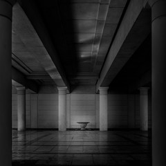Abstract, empty, modern, dark concrete room with light reflections and columns - Artistic interior/exterior background - Black-and-white building frame