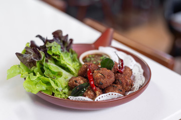 Thai deep fried minced pork and herb balls