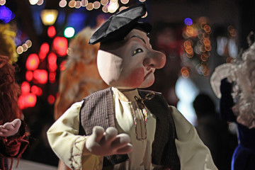 a amazing man puppet dancing on holiday