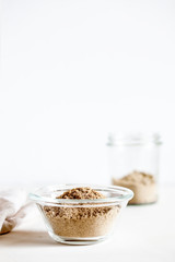 Various gluten free flour corn,sesame,oat,coconut in bowl on white background.Alternative to wheat flour for keto paleo diet.Healthy eating,dieting food concept.Vertical orientation,copy space