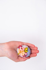 Easter egg in hands on a white isolated background.