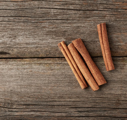 brown cinnamon sticks on a gray wooden background