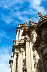 Fototapeta na wymiar The beautiful cathedral at the city of Murcia, Spain. A side view of the facade of this monument. The building is elaborately decorated in the plateresque style, although the original structure is go