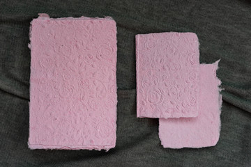 Fototapeta premium Handmade paper. A stack of texture paper. Concept of recycling used paper, ecology theme.