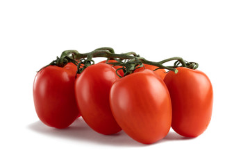 Oblong fresh red tomatoes isolated on a white background with clipping paths with shadow and without shadow