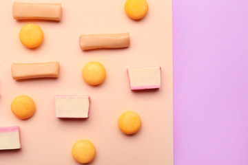 Different chewing gums on color background