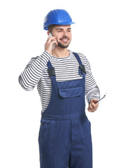 Handsome male worker talking by mobile phone on white background