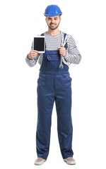 Handsome male worker with tablet computer on white background