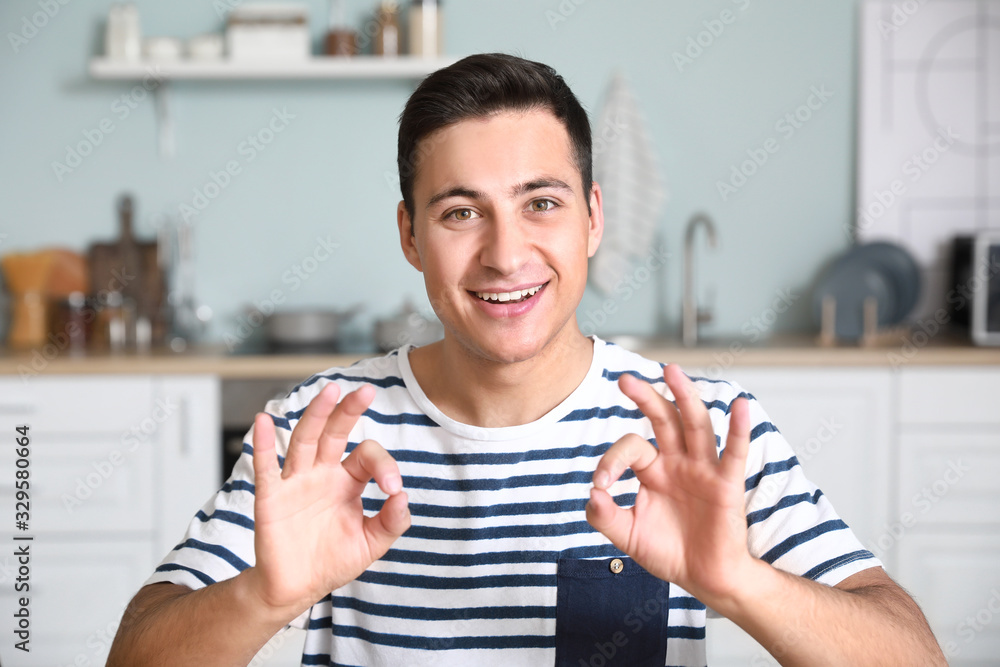 Canvas Prints Young man using video chat at home