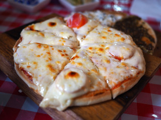 Cheese Manakish - Fla tbread topped with cheese. Traditional Arab cuisine