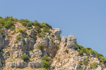 Mountains and rocks on the beach in summer on a Sunny day