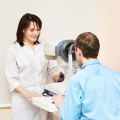 ophthalmologist doctor in exam optician laboratory with male patient. Men eye care medical...
