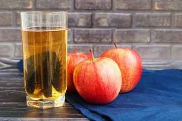 Natural apple juice on a dark background