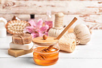 Obraz na płótnie Canvas Composition with spa items and honey on table