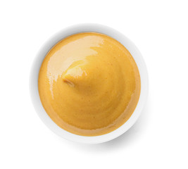 Bowl of tasty honey mustard sauce on white background