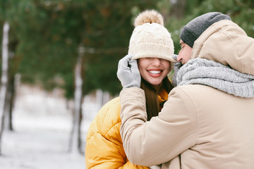 Happy young couple in park on winter day