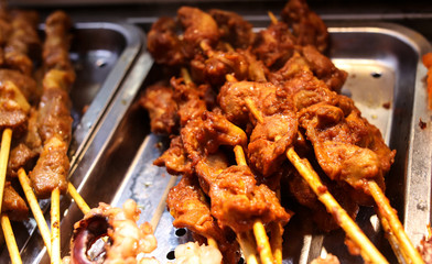 Animal meat on wooden sticks for grilling